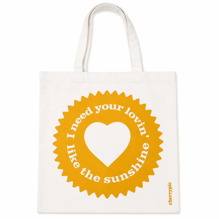 Wit-gele canvas strandtas "I need your lovin"